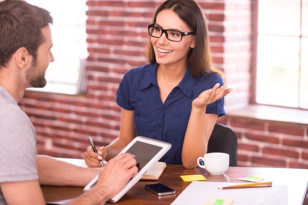 business-discussion-between-man-and-woman-at-desk-2026-03-19-06-59-34-utc