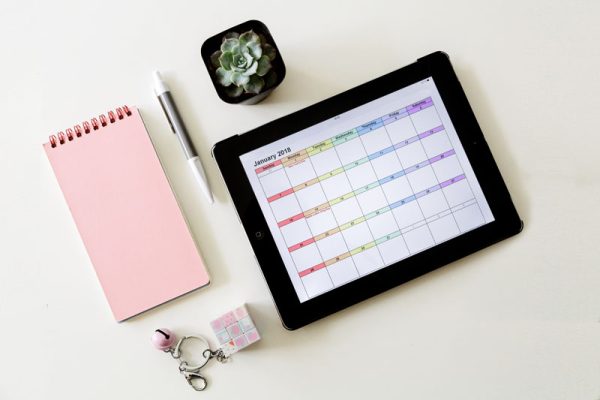 top-view-of-tablet-and-office-supplies-on-white-ba-2024-11-07-13-20-08-utc